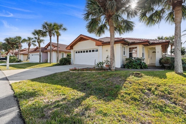 view of front of house featuring a garage and a front yard