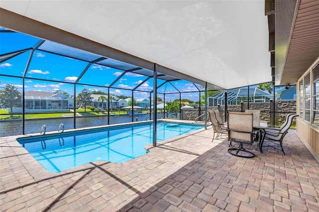 view of pool featuring a water view, a lanai, and a patio