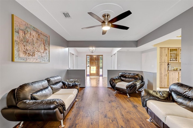 living room featuring ceiling fan and wood-type flooring