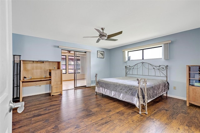 bedroom with dark hardwood / wood-style floors and ceiling fan