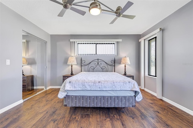 bedroom featuring dark wood-type flooring and ceiling fan