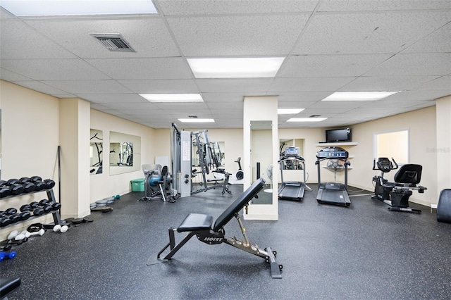 exercise room with a drop ceiling