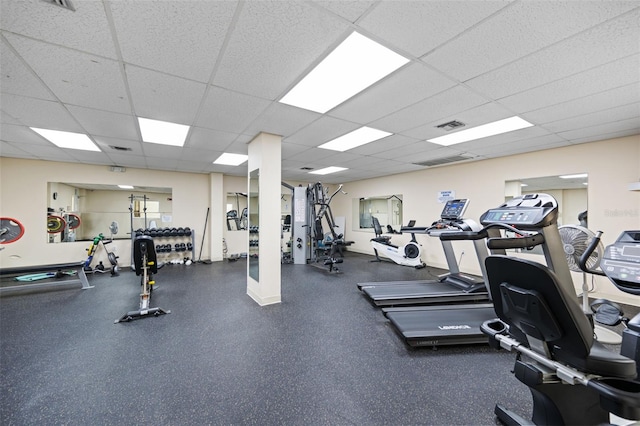 workout area with a paneled ceiling