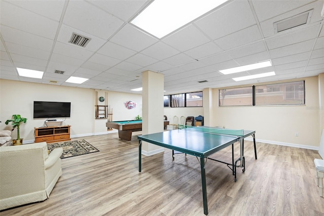 recreation room featuring pool table, a paneled ceiling, and light hardwood / wood-style floors