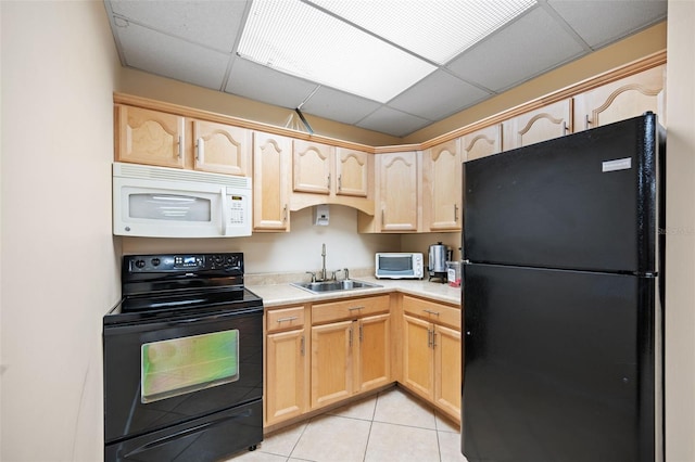 kitchen featuring sink, a drop ceiling, black appliances, light tile patterned flooring, and light brown cabinetry