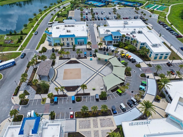 birds eye view of property with a water view