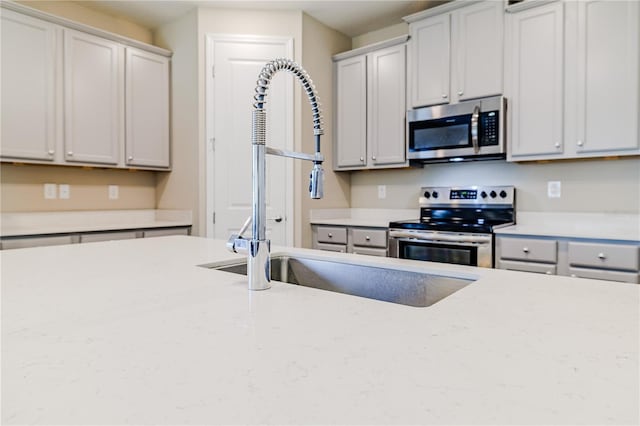 kitchen with stainless steel appliances and a sink