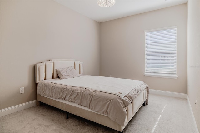 bedroom featuring carpet floors and baseboards