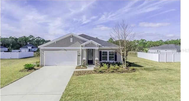 craftsman-style house with a front lawn, fence, a garage, and driveway