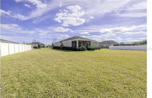 view of yard with fence