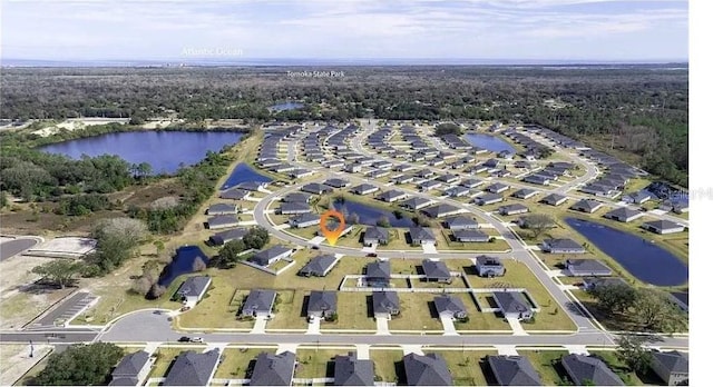 bird's eye view with a water view and a residential view