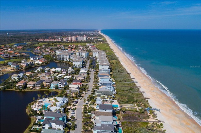 aerial view featuring a water view and a beach view