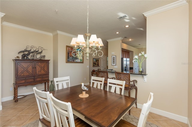 tiled dining room featuring crown molding, a textured ceiling, and a notable chandelier