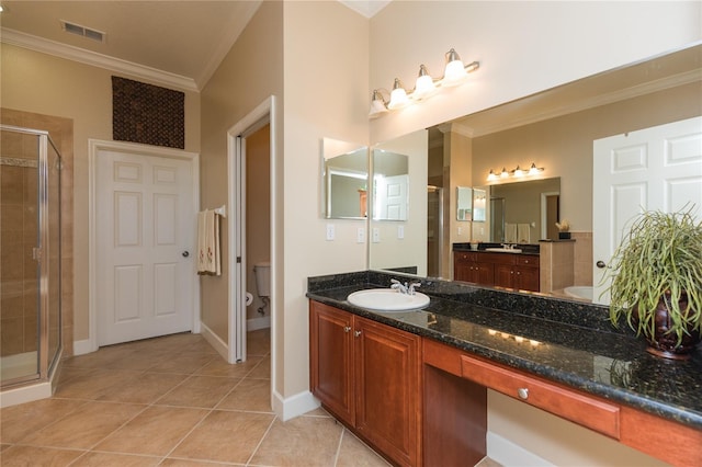 bathroom with tile patterned floors, toilet, an enclosed shower, ornamental molding, and vanity