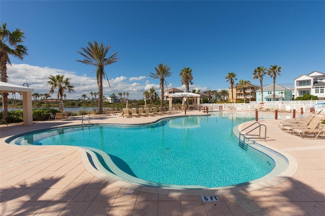 view of swimming pool with a patio area