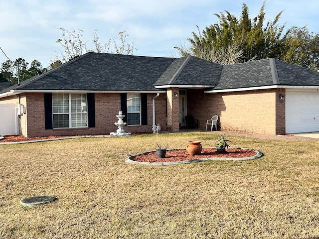 single story home with a garage and a front lawn