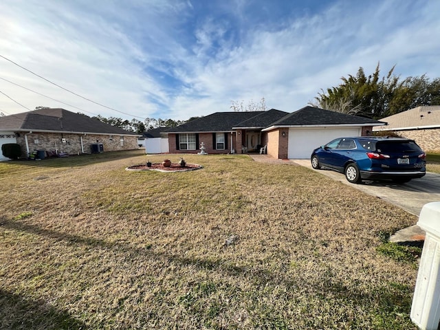 ranch-style house featuring a garage and a front yard