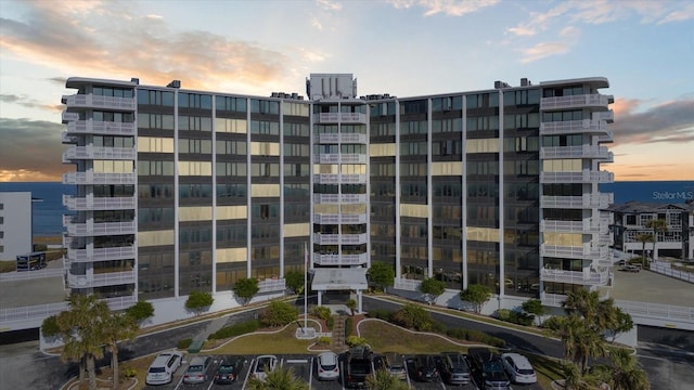 view of outdoor building at dusk