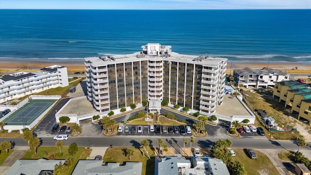 aerial view featuring a water view and a beach view