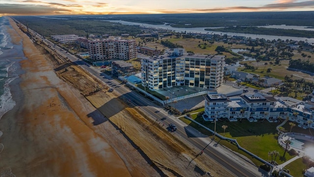 aerial view at dusk with a water view