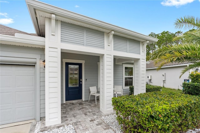 doorway to property featuring a garage