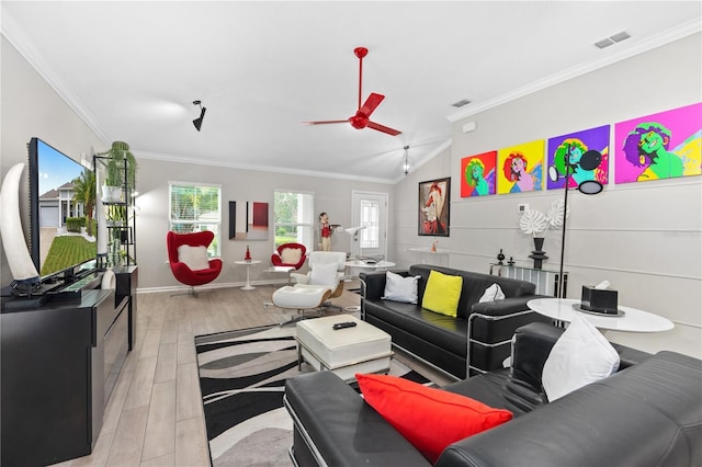 living room with crown molding, ceiling fan, lofted ceiling, and light hardwood / wood-style flooring