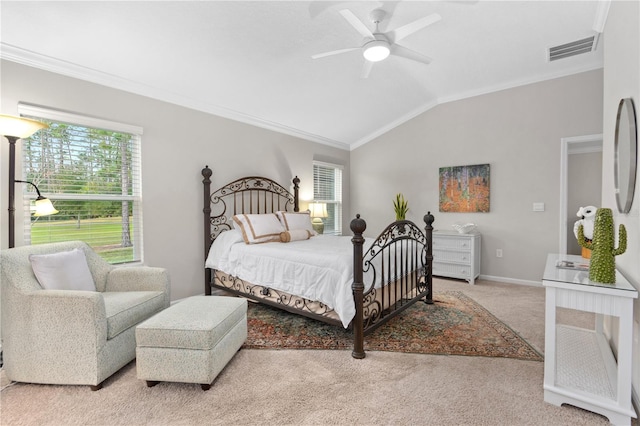 carpeted bedroom featuring ornamental molding, lofted ceiling, and ceiling fan