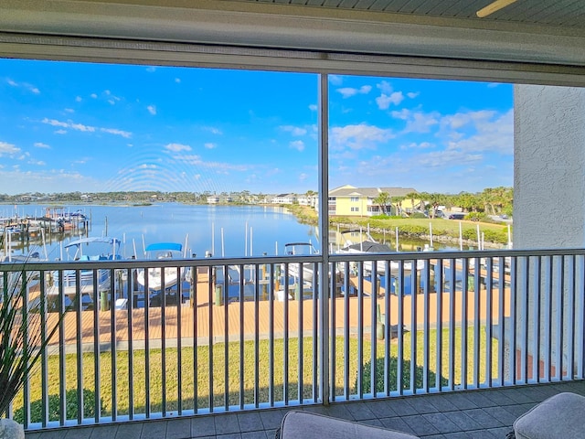 balcony featuring a water view