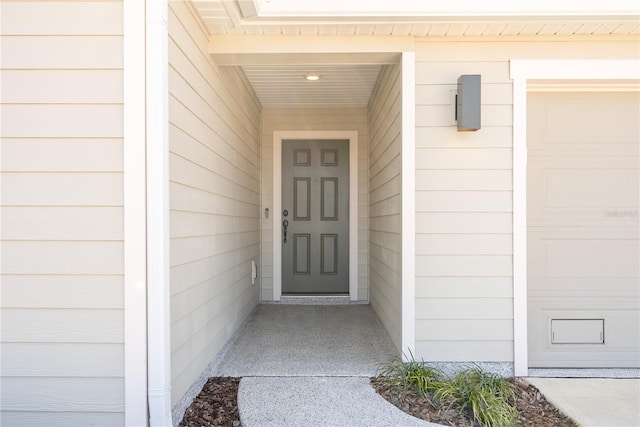 property entrance with a garage