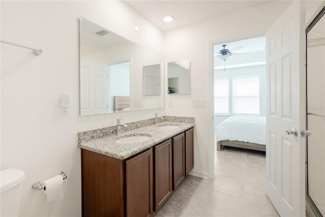 bathroom with vanity, tile patterned floors, ceiling fan, and toilet