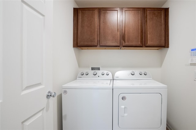 laundry area with cabinets and washer and dryer