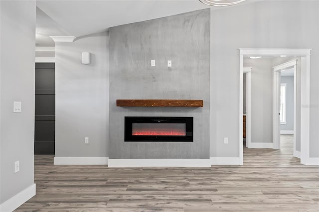 unfurnished living room with hardwood / wood-style flooring