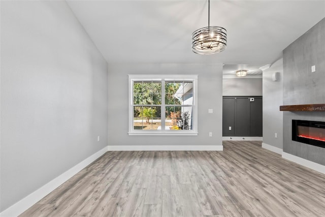 unfurnished living room featuring light wood-type flooring