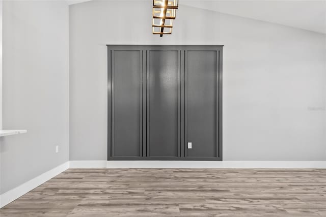 interior space with lofted ceiling and light hardwood / wood-style floors