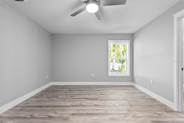 unfurnished room featuring ceiling fan and light hardwood / wood-style flooring