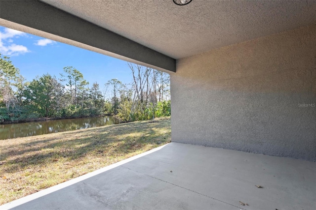 view of patio / terrace featuring a water view