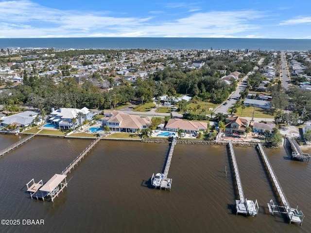 birds eye view of property featuring a water view