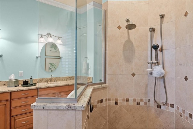 full bath with ornamental molding, walk in shower, and vanity