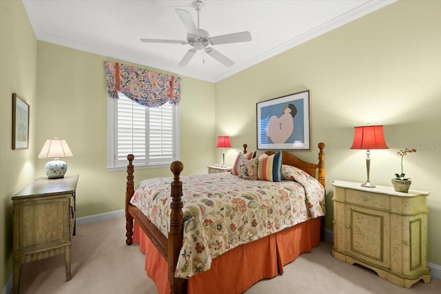 bedroom featuring ornamental molding, light colored carpet, ceiling fan, and baseboards