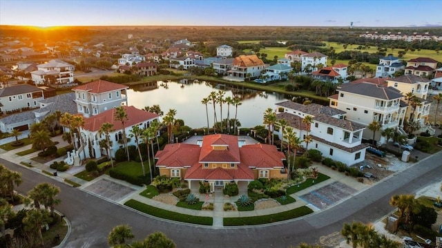 aerial view with a water view and a residential view