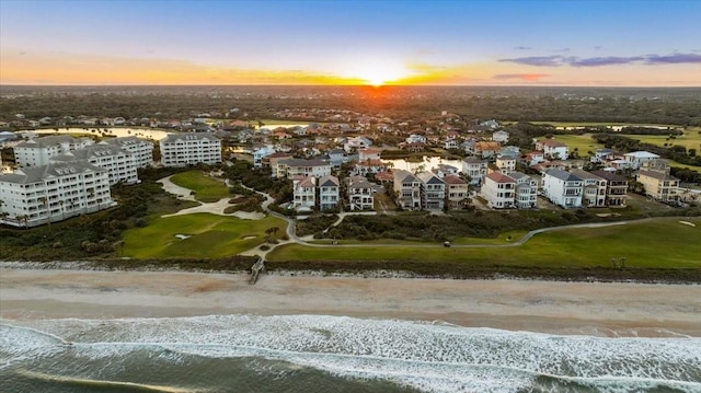 aerial view at dusk with a water view