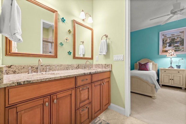 bathroom featuring double vanity, tile patterned flooring, a sink, and a ceiling fan