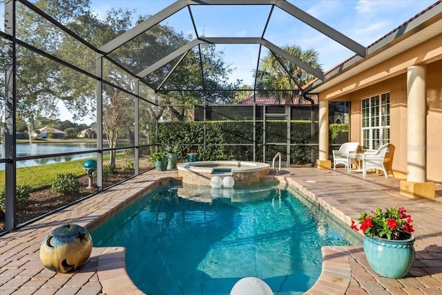 view of swimming pool with a patio, a water view, a lanai, and a pool with connected hot tub