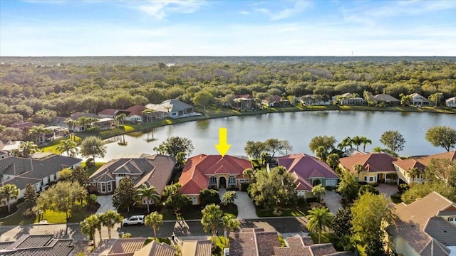 bird's eye view featuring a water view and a residential view