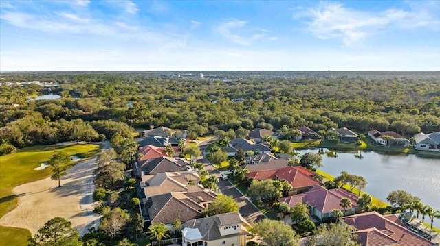 aerial view featuring a water view, a residential view, and a view of trees