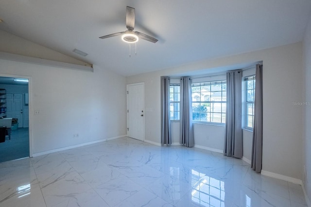 unfurnished room featuring lofted ceiling and ceiling fan