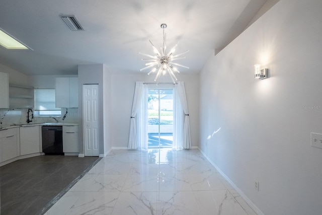 interior space featuring vaulted ceiling, sink, and a notable chandelier