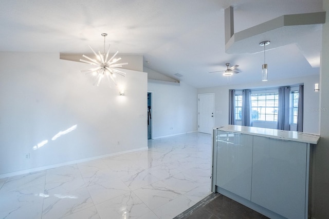 kitchen featuring ceiling fan with notable chandelier and vaulted ceiling