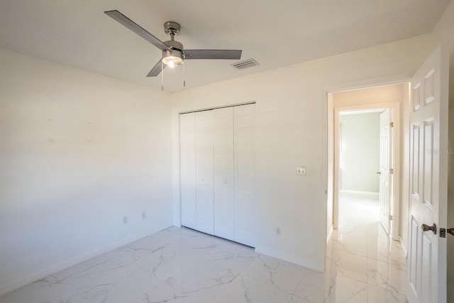 unfurnished bedroom with a closet and ceiling fan