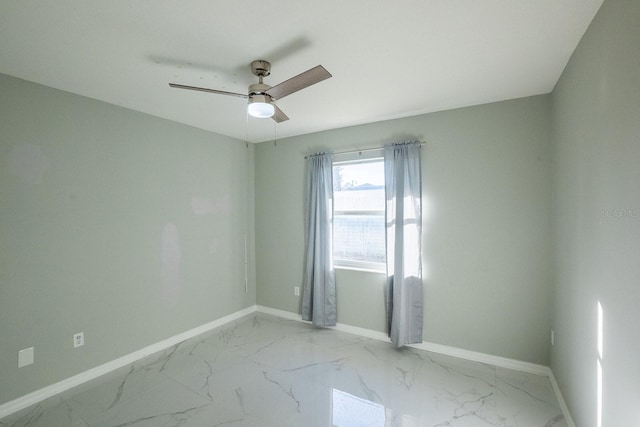 spare room featuring ceiling fan